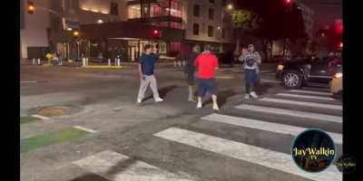 2 guys fighting outside liquor store with bats & sticks
