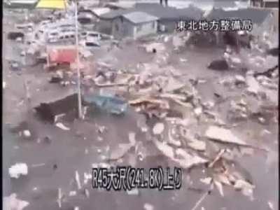 The catastrophic destruction a Tsunami caused by the Tohoku earthquake in 2011
