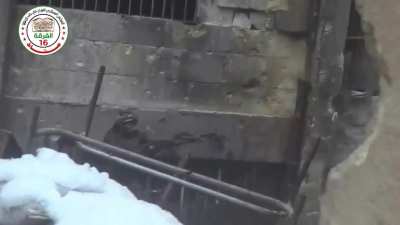 FSA 16th Division fighters exchange fire with the SAA during clashes in Bustan al-Basha, Aleppo - 1/13/2015