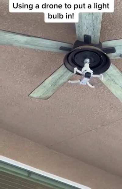 Using a drone to screw a light bulb