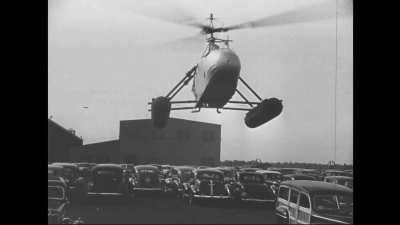 Igor Sikorsky demonstrating his Vought-Sikorsky VS-300 helicopter prototype fitted with floats