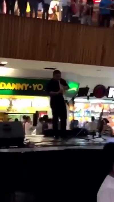The mall started flooding so the live band starts to perform the Titanic song