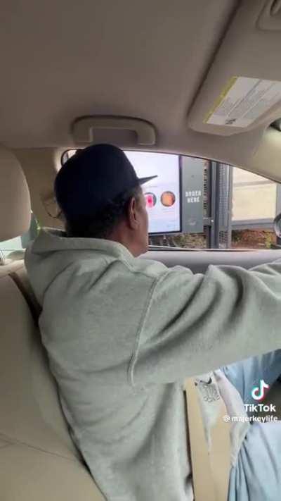 Old man having trouble with Starbucks order