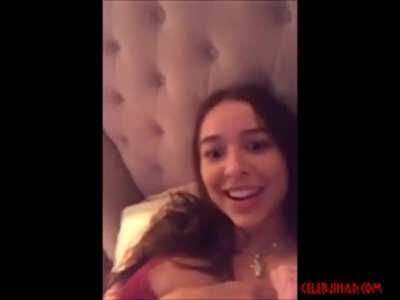 She can't help but play with hey boobs!