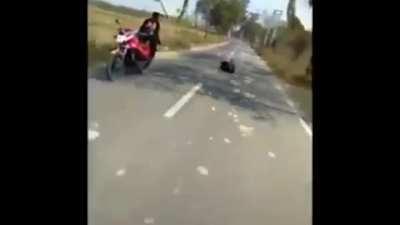 Standing on a moving bike!