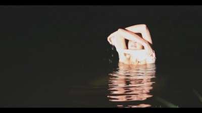 beautiful Katie is bathed in headlights