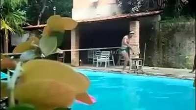 Just a kid tightroping over a swimming pool