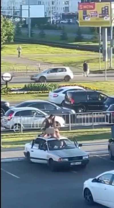 Just two drunken women fucking on the roof of a car NSFW