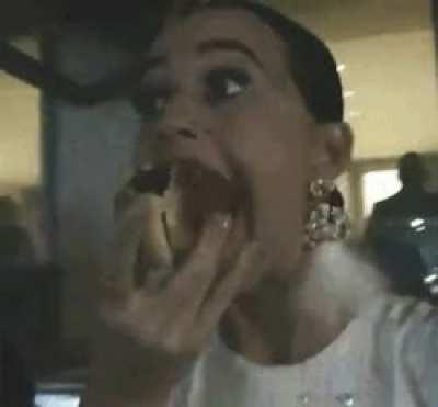 Trying to swallow hot dog