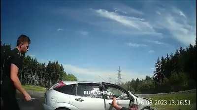 Man dangling from window gets hit by oncoming car