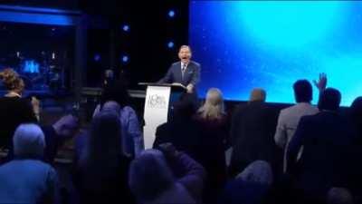 Satan wearing a skin-suit laughing with church goers about the election