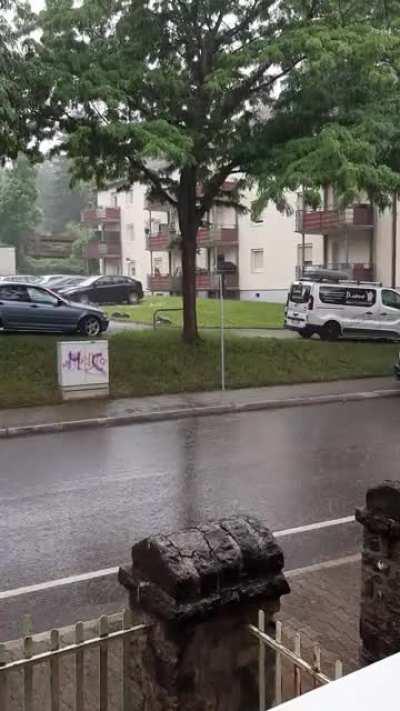 Rain in Germany (busy street + train in backround)