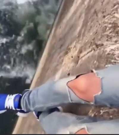 Swinging your girlfriend on a ledge