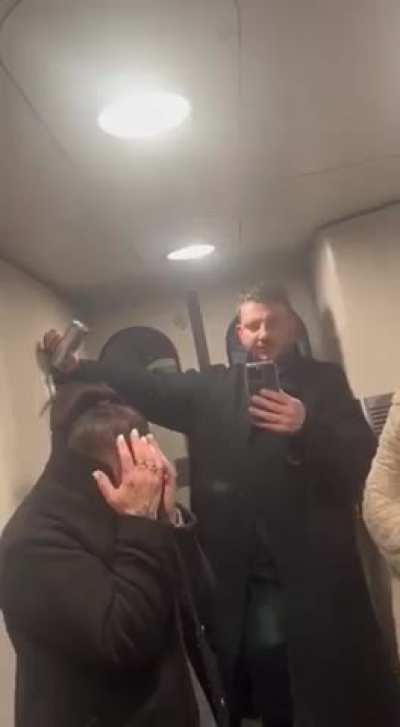 Drunk English xenophobe rants on a train, then brags about hitting his girlfriend.