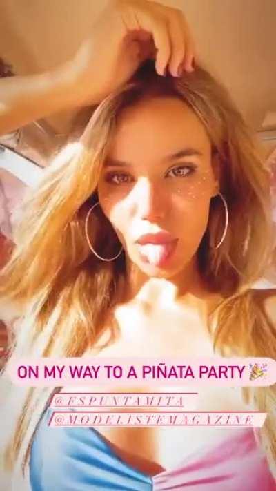 Sticking her tongue out