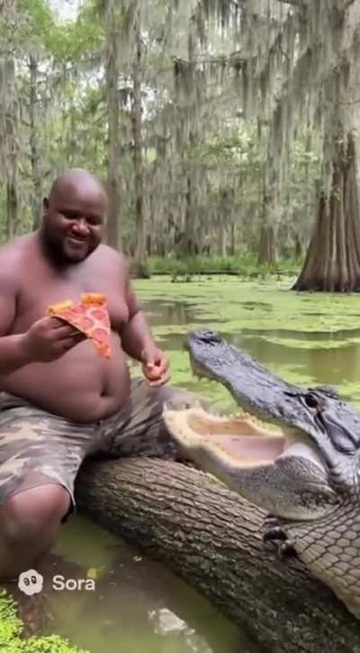 Gumbo Slice and Gator Slice sharing pizza
