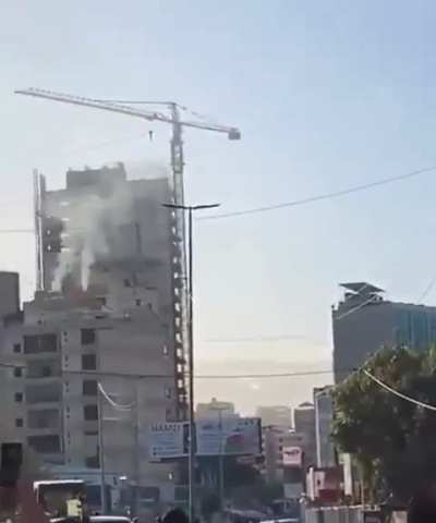An Israeli bomb hits the targeted building, but fails to explode in Beirut