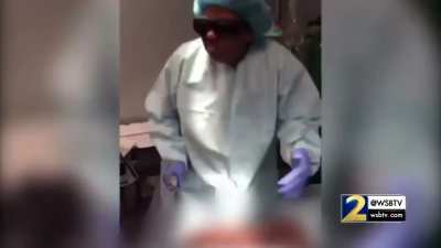Now suspended doctor dancing and listening to music during surgical procedures.