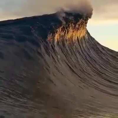 A big wave touching the clouds