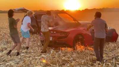Driving half-a-million-dollar Ferrari through a dry cornfield