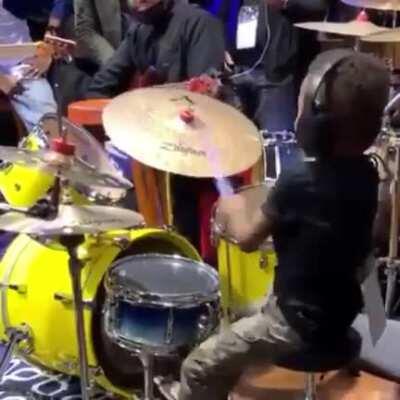 Young boy goes off on a drum solo