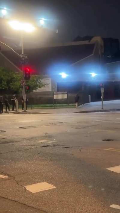 LAPD shoots an innocent bystander at close range while she was walking back to her apartment; camerawoman and other witnesses then come to her aid