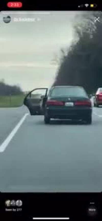 Marylander drives across narrow bridge with door open to haul a TV