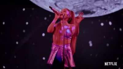 She is beautiful performing/singing