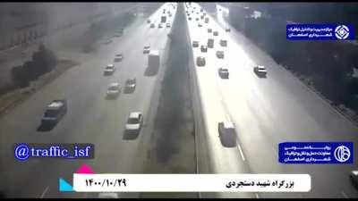 Woman died in a car accident after she tried to save a dog fell from another car at the highway. Happened in Isfahan, Iran.