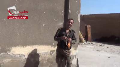 Syrian rebel using sling to launch grenades