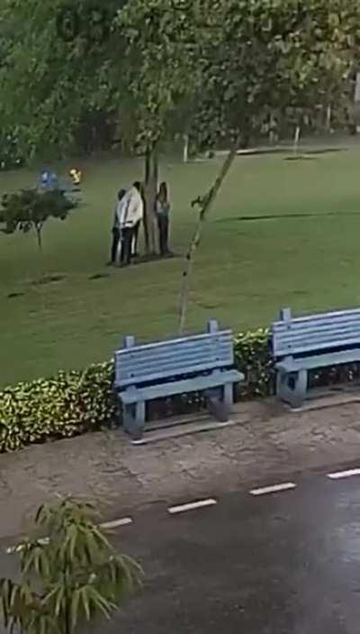 Standing under a tree