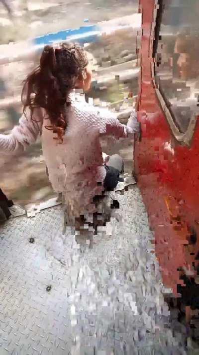 A girl jumping from a Moving train