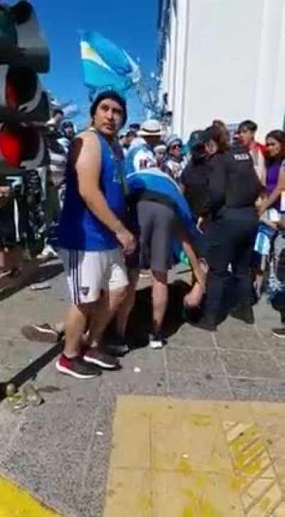 Trying to climb a traffic light pole during World Cup celebrations