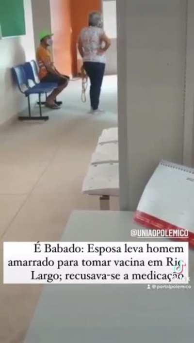 wife takes tied up anti-vaccine husband to get vaccinated