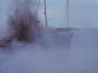 US Balao-class submarine sinks a Japanese sailing vessel with gunfire circa 1945