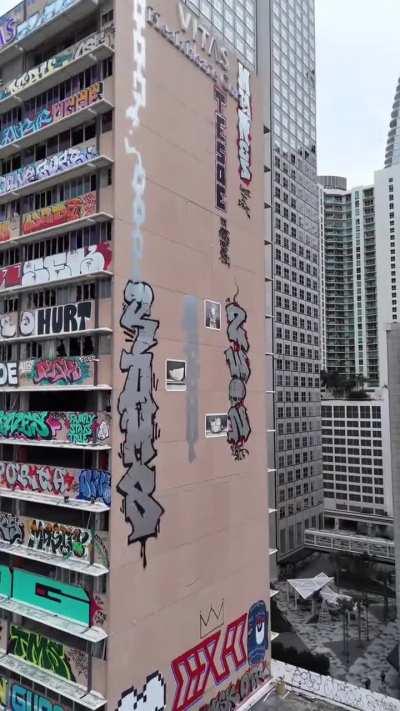 Graffiti artists have turned an abandoned building in downtown Miami into a massive and beautiful work of art. I'm not sure how some of these tags were even possible...