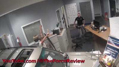 Car into police building.