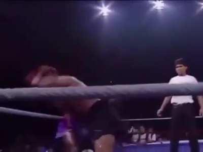 Ramon Dekkers falling out of the ring, trying to elbow as hard as he can.