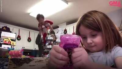 Dad hysterically dances as the daughter does art and craft for the virtual class