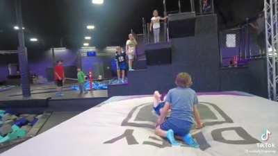 Guy filming can't help but chuckle