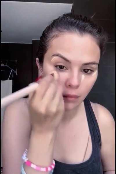 Extremely beautiful and sexy applying her makeup
