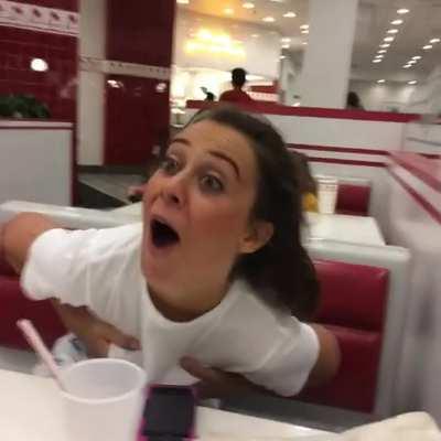 Girl has her shirt pulled up, bare boobs exposed