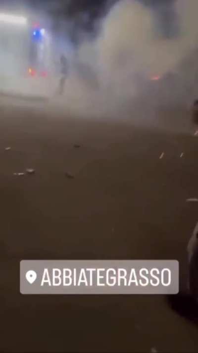 Shooting fireworks at firefighters putting out a fire.