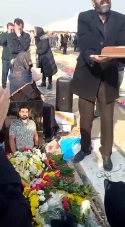 This guy was killed by the Islamic Regime after the US-Iran soccer match, and now his father is dancing on his grave to celebrate his 22nd birthday