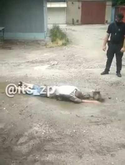 A man is being chased and tries to swim away