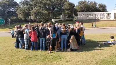 QAnon conspiracy theorists singing Country Roads in Dallas a week after JFK Jr failed to return from the dead