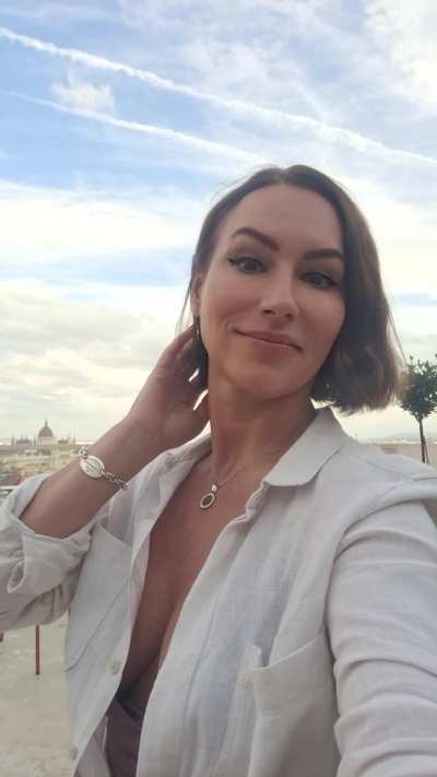 Alluring titties under an unbuttoned blouse