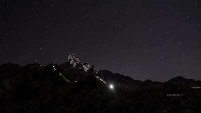 Starlapse taken from Mardi High Camp / Trekkers with torchlights on the way to the Base camp