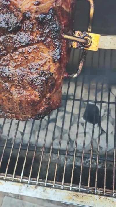 charcoal rotisserie pork butts.