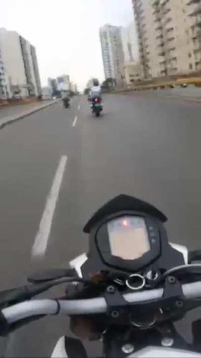 Motorbike crashes car trying to u-turn in a no-u-turn road